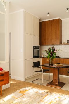 the kitchen is clean and ready to be used as a dining room or living room