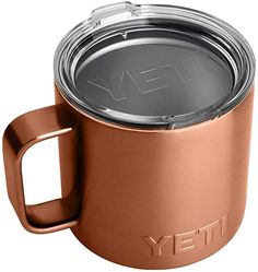 the yeti coffee mug is made from stainless steel and has a lid with a handle