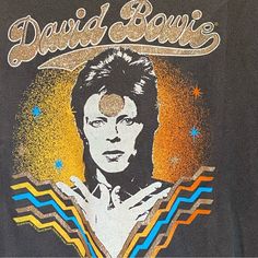 Bowie - David Bowie Top New With Tags Size L 100% Cotton Gray Garment Washed Cotton Vinyl Image In Multiple Colors With Gold Glitter Cropped Top T-Shirt Crewneck Top Shirt And Vinyl Image On Front Have An Intentional Distressed Appearance Sleeves Have A Raw Edge, They Were Cut By The Manufacturer All Measurements Are Approximate: Chest Measures Approximately16.75 " From Arm Pit To Arm Pit Overall Length Measures Approximately 18.5" From Top Shoulder Seam To Bottom Hem This Is A Fabric That Has S 80s David Bowie, David Bowie Shirt, David Bowie T Shirt, Glitter Crop Top, Rock Tshirt, Bowie Ziggy Stardust, David Bowie Ziggy Stardust, David Bowie Ziggy, Knot Crop Top