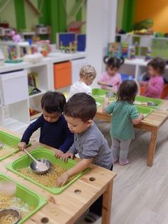 two children are playing with their food in the playroom