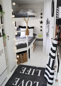 a bedroom with bunk beds and black and white decor