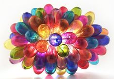 a multicolored glass flower on a white background