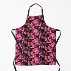 an apron with pink flowers on it is hanging from the front, and has black straps