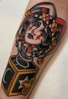 a woman's arm with a tattoo on it and a dice in the middle