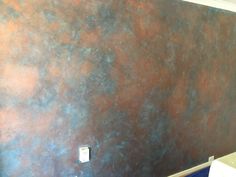 a bathroom wall painted with metallic paint