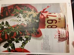 a person holding up a magazine with an image of a plant in the middle of it