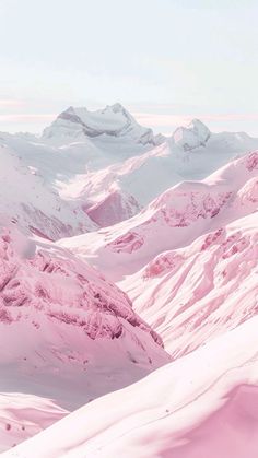 the snow covered mountains are pink in color