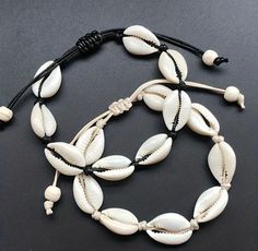 Looking for a stylish and distinctive shell conch bracelet? Try our Bohemian shell conch bracelet instead! The elegance of beach-inspired jewellery is combined with the charm of Boho style in this handcrafted masterpiece. This elaborately braided design created by the pearls and shells evokes the serenity of ocean waves and the spirit of summer.  This bracelet epitomizes unisex style and coastal charm, whether strolling down the beach or adding a touch of beachy beauty to your everyday outfit. W Seashell Bracelet, Knit Bracelet, Anklets Boho, Rope Jewelry, Bohemian Accessories, Shell Bracelet, Foot Jewelry, Shell Jewelry, String Bracelet