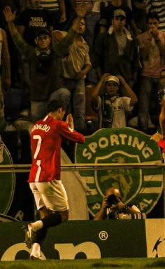 a soccer player is celebrating his team's victory