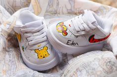 Nike air force 1 On the theme of Winnie the Pooh - If you wish, it is possible to personalize the sneakers with a first name. - If you want another character in particular, do not hesitate to contact us by private message. Here all our creations are hand painted by us and made with all our heart! 💗 Imagine your pair of sneakers and we will create it for you So that you are unique and original! ️ ⚜️(each Custom is unique so not identical thank you)⚜️ If you would like any information, please do not hesitate to contact us by message. Winnie The Pooh Sneakers, Painted Nike Air Force, Painted Nikes, Nike Air Force 1 Custom, Shoe Designs, Air Force 1 Custom, Baskets Nike, Custom Basketball, Baby Sneakers