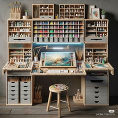 a desk with lots of crafting supplies on it and shelves filled with paint, pencils