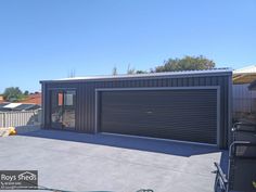 a garage with an open door on the side of it