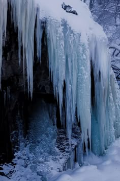 an icy waterfall with icicles hanging from it's sides