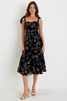 Standout from the rest with your charming presence in the Lulus Sweetest Era Black Floral Velvet Burnout Tie-Strap Midi Dress! Soft velvet, with a sweet burnout floral motif throughout, shapes this darling dress that falls from tying straps into a ruffled, sweetheart neckline and a fitted bodice with seamed cups. High, fitted waist sits atop a flowy A-line skirt that falls to a tiered, midi hem. Smocking and hidden zipper/clasp at back. Fit: This garment fits true to size. Length: Mid-calf lengt Velvet Burnout, Dress Velvet, Adhesive Bra, Darling Dress, Strapless Bra, Fitted Bodice, Full Skirt, Soft Velvet, Floral Motif