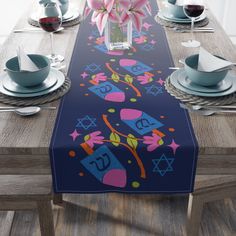 the table is set with place mats, plates and napkins for jewish holiday celebrations