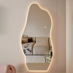 a mirror that is on the side of a wall