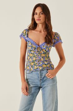 Short sleeve floral print top Lace trim around sleeves and front bust Tie detail at bust Smocked elastic back Concealed side zipper closure Partially lined Self: 100% Viscose / Lining: 100% Polyester (excluding trim) Dry clean only Style #AT18333