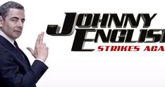 johnny english strikes again with his hand in front of the words, johny english strikes again