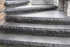 stone steps leading up to a brick building