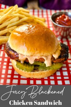 a chicken sandwich and french fries on a red and white checkered tablecloth with the words fancy blackened chicken sandwich