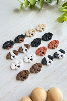 there are many small dogs made out of clay on the table next to some eggs