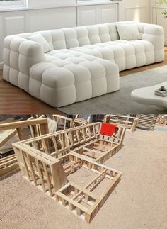 two pictures side by side one with a white couch and the other with wooden frames