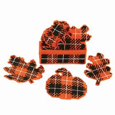 three pieces of plaid fabric with orange and black designs