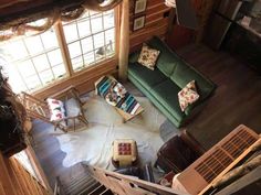 an aerial view of a living room with couches and chairs