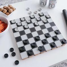 a chess board and some spices on a table