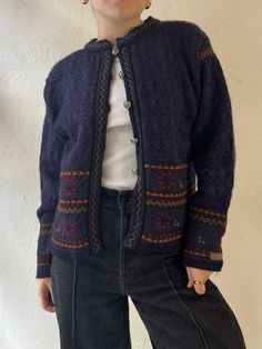 - Vintage Dale of Norway nordic ski sweater - Minor repair to right side collar - 100% wool - Pewter buttons - Model is 5'  - Tagged S Chest: 19" Length: 20" Sleeve: 20" We are not responsible for lost, stolen, or damaged packages once they have been shipped. Any additional customs duties or taxes incurred on international orders are the responsibility of the buyer. Please note that our items are vintage and may have minor flaws or imperfections due to their age, which adds to their unique chara Vintage Wool Sweater, Vintage Wool Long Sleeve Cardigan, Vintage Wool Cardigan With Pockets, 90s Purple Winter Sweater, Vintage Purple Winter Cardigan, Vintage Purple Cotton Outerwear, Purple Knit, Dale Of Norway, Ski Sweater