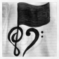 a black and white photo of a treble on a t - shirt with the word music