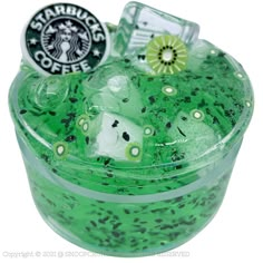 a green drink in a plastic cup with starbucks's logo on top