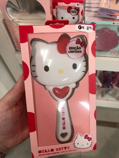 the hello kitty hair brush is in its box and ready to be bought for sale