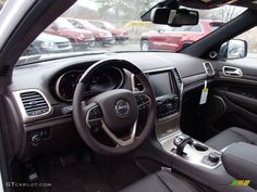 the interior of a car with several cars in the background