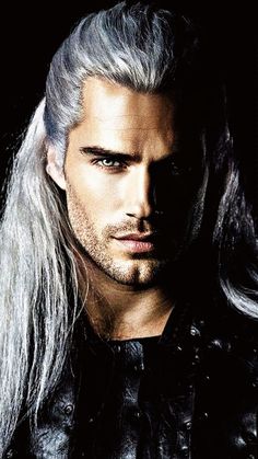 a man with long white hair and grey hair