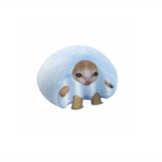 a small stuffed animal sitting on top of a blue pillow