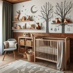 a baby's room decorated in white and brown with trees, deers and birds on the wall