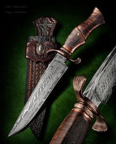 two knives with intricate carving on them sitting side by side next to each other in front of a green background