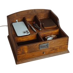 a wooden desk organizer with compartments for various items