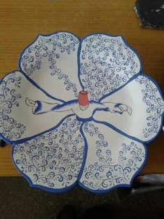 a blue and white plate with an image of a woman on it