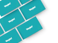 four blue business cards with the word volgo written on them in white letters and green background