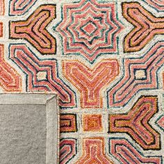 an area rug with different colors and shapes