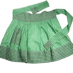 a green and white checkered dress on a white background