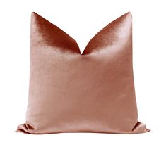 a pink pillow on a white background