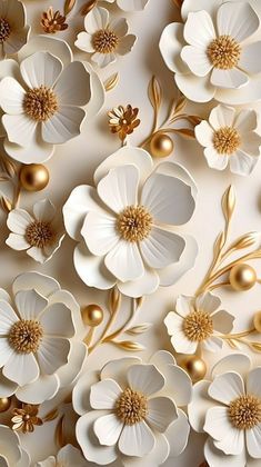 white and gold flowers are on the wall