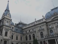 an old building with a clock tower on top