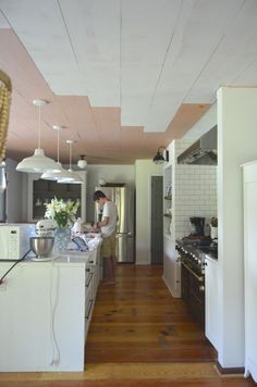 a woman is preparing food in the kitchen