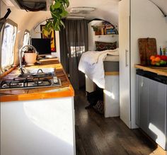 the kitchen is clean and ready to be used as a camper or home office