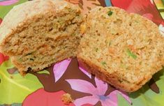 two pieces of bread sitting on top of a colorful table cloth