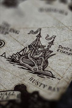 a close up view of a map with a boat on it's back side